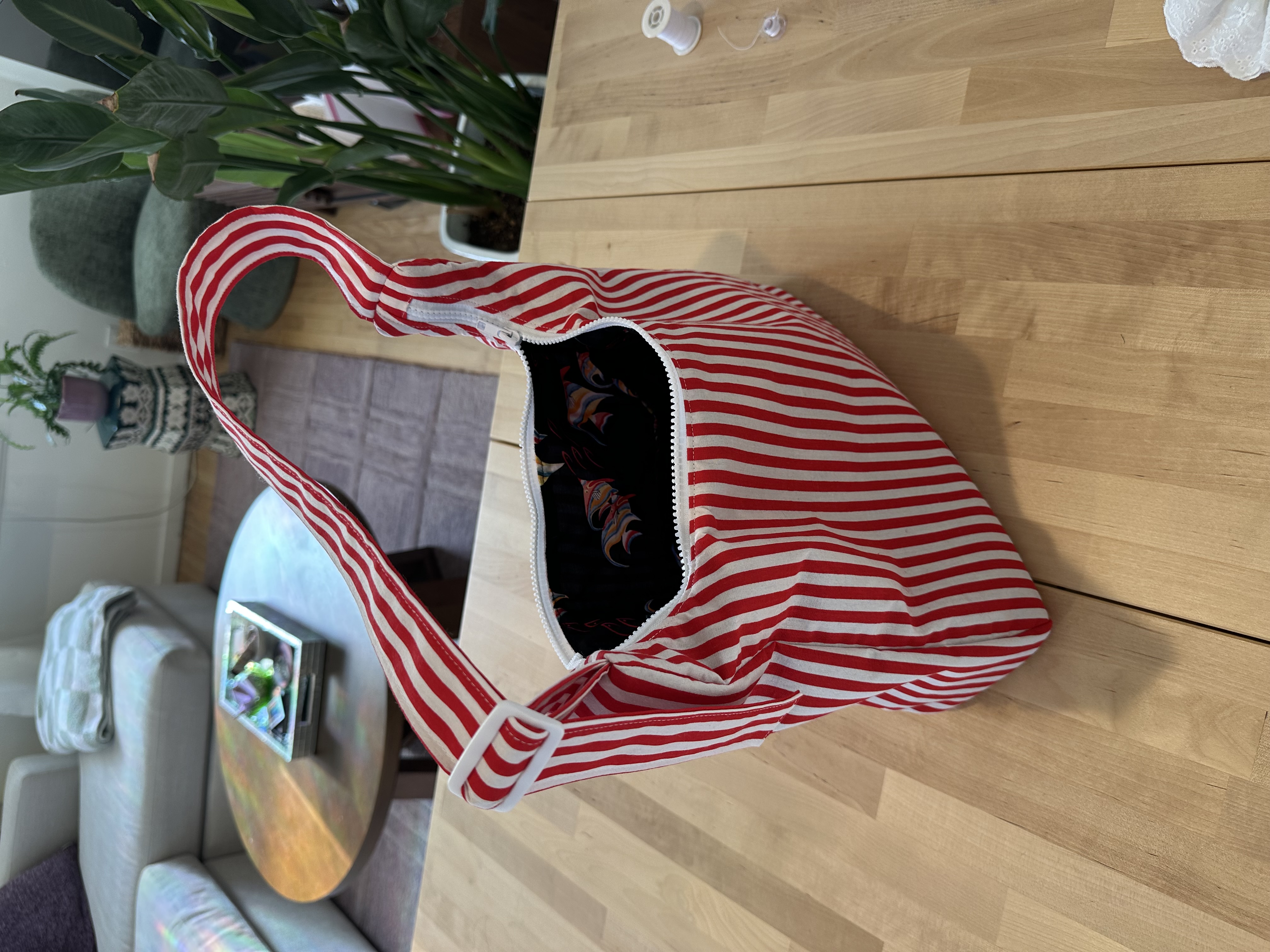 The finished Billy Bag open, showing the fish print lining and zipper